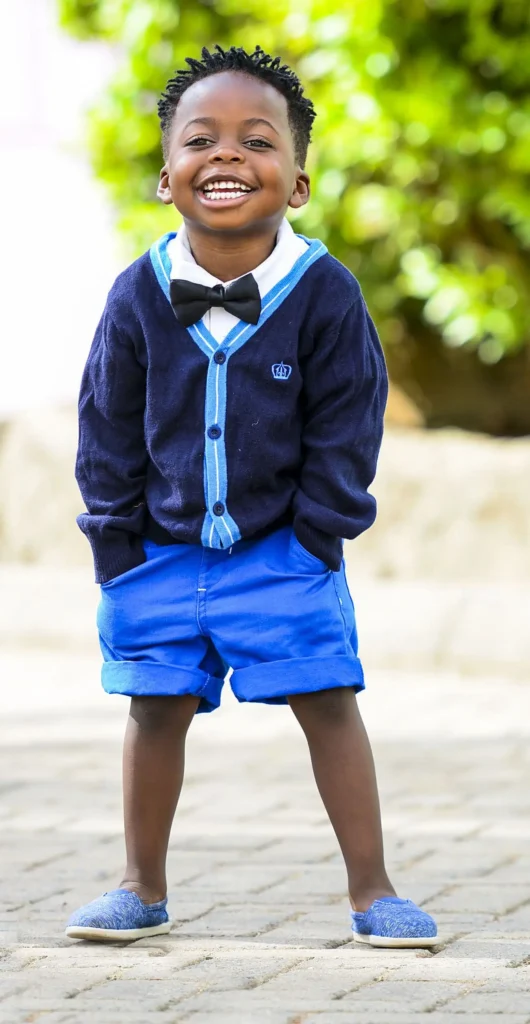SONGS TO MY SON: Re-Writing the Sad narratives 2 Songs to my son: a young by smiling with his hands in his pockets